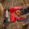 Battery Powered Cordless Staple Gun Being used on Fence